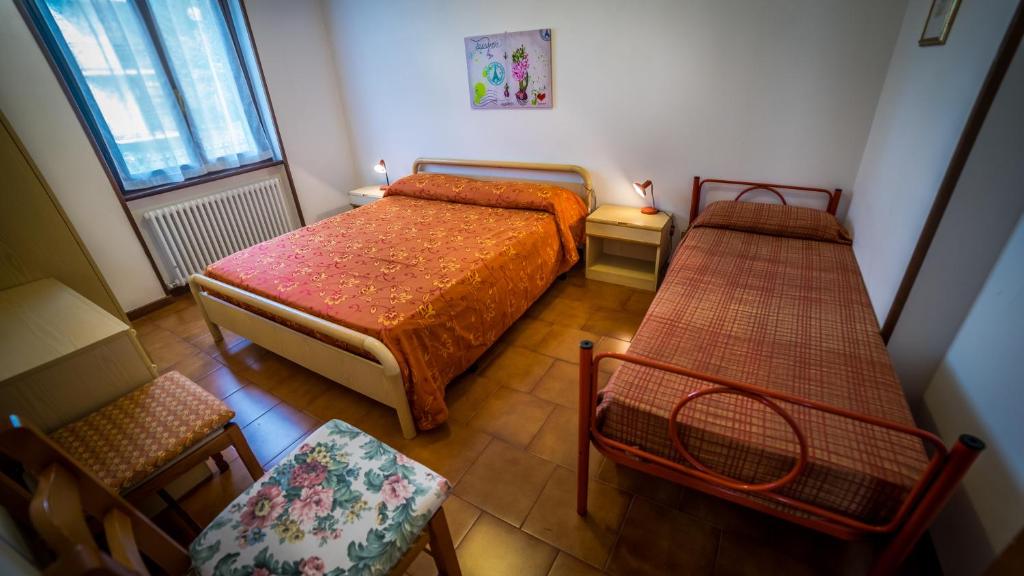 Postel nebo postele na pokoji v ubytování Casa Enrico