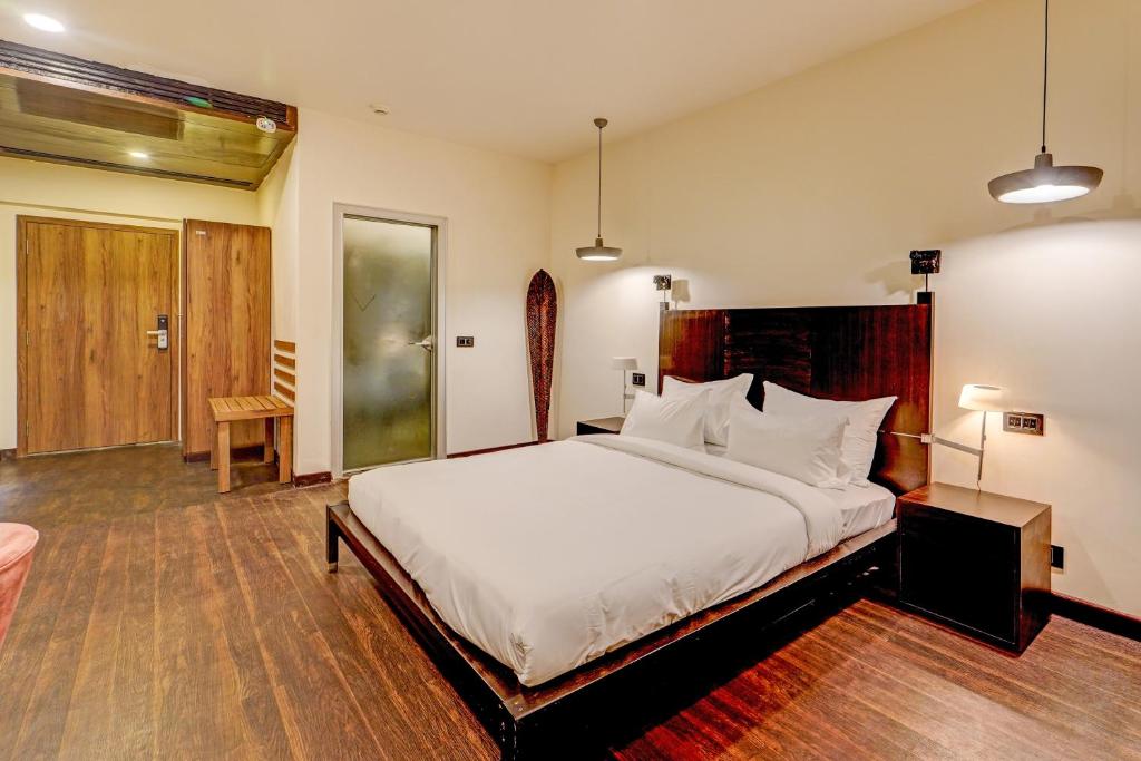 a bedroom with a large white bed in a room at Palette - The Slate Hotel in Chennai