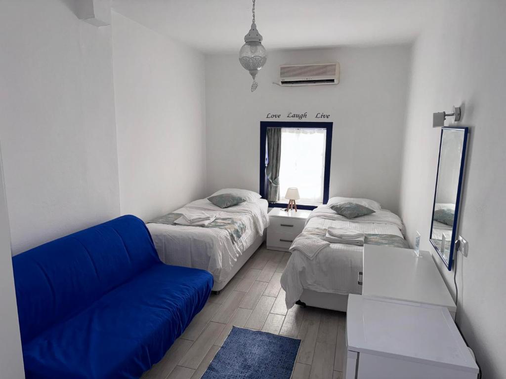 Postel nebo postele na pokoji v ubytování White and Blue Bodrum
