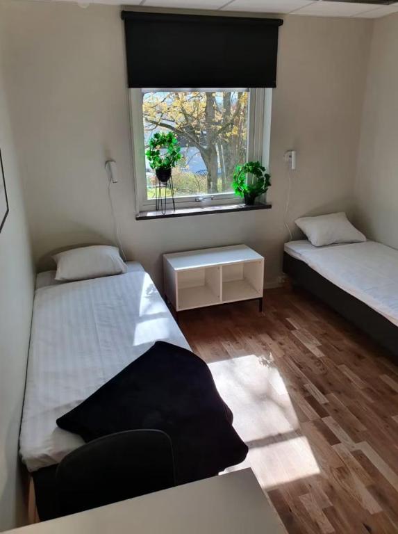 Postel nebo postele na pokoji v ubytování Forenom Hostel Lund Örtofta