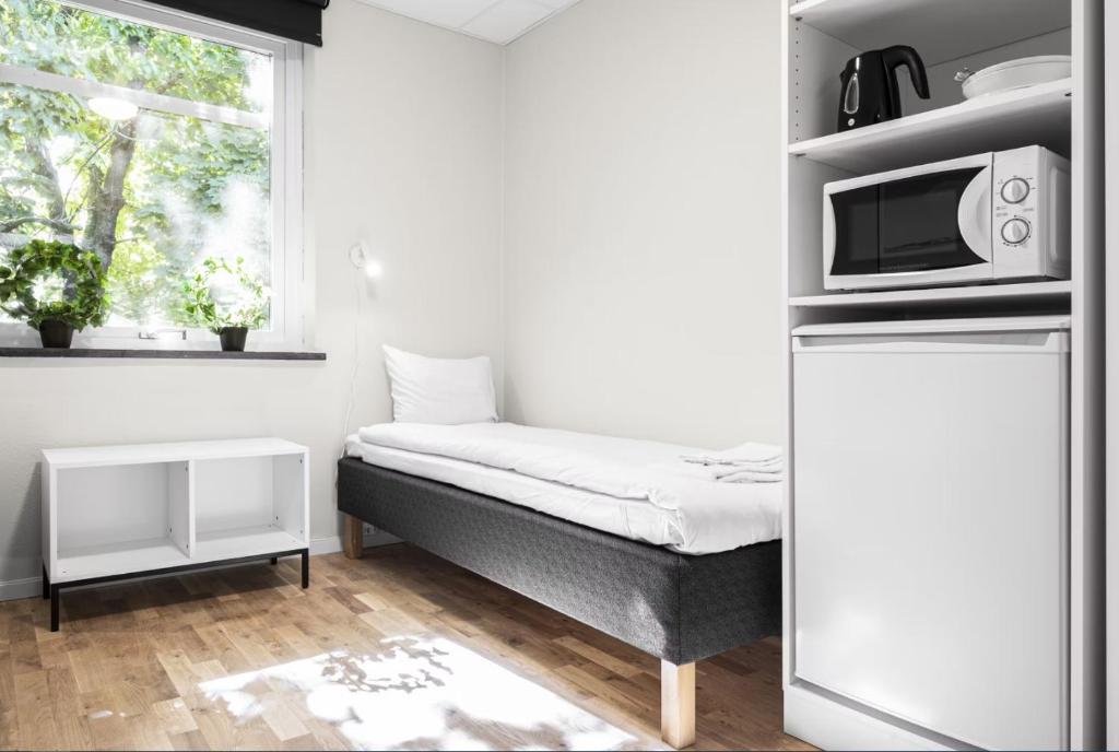 Postel nebo postele na pokoji v ubytování Forenom Hostel Lund Örtofta
