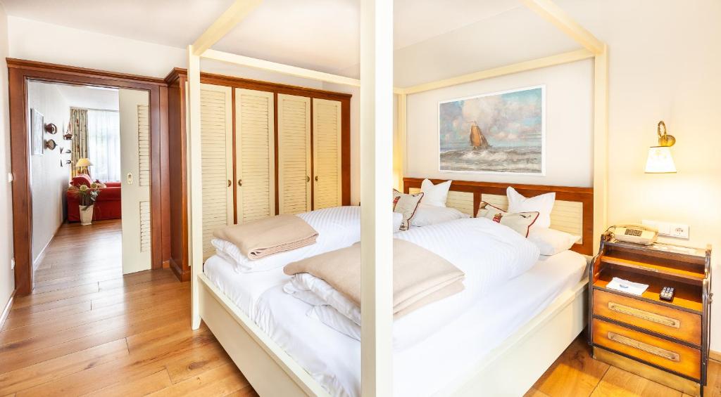 Postel nebo postele na pokoji v ubytování Hotel Friese-up AnnerSiet-
