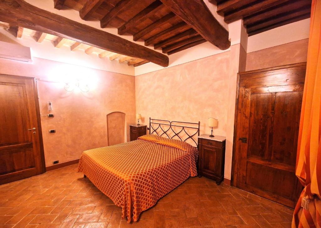 Postel nebo postele na pokoji v ubytování La Locanda di Quercecchio