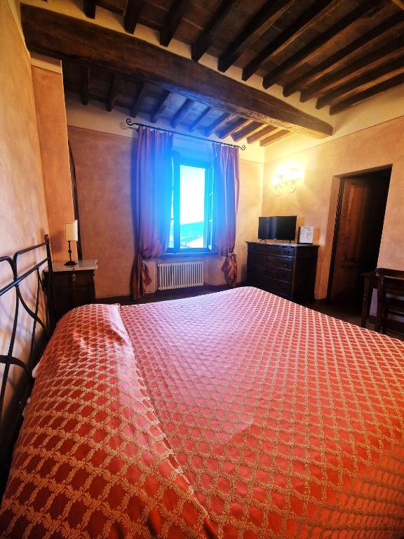 Postel nebo postele na pokoji v ubytování La Locanda di Quercecchio