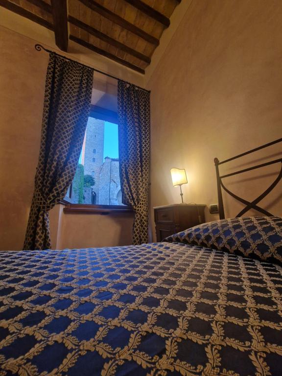 Postel nebo postele na pokoji v ubytování La Locanda di Quercecchio