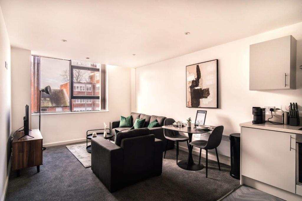 a living room with a couch and a table at Contemporary 1 Bed Apartment in Central Preston in Preston