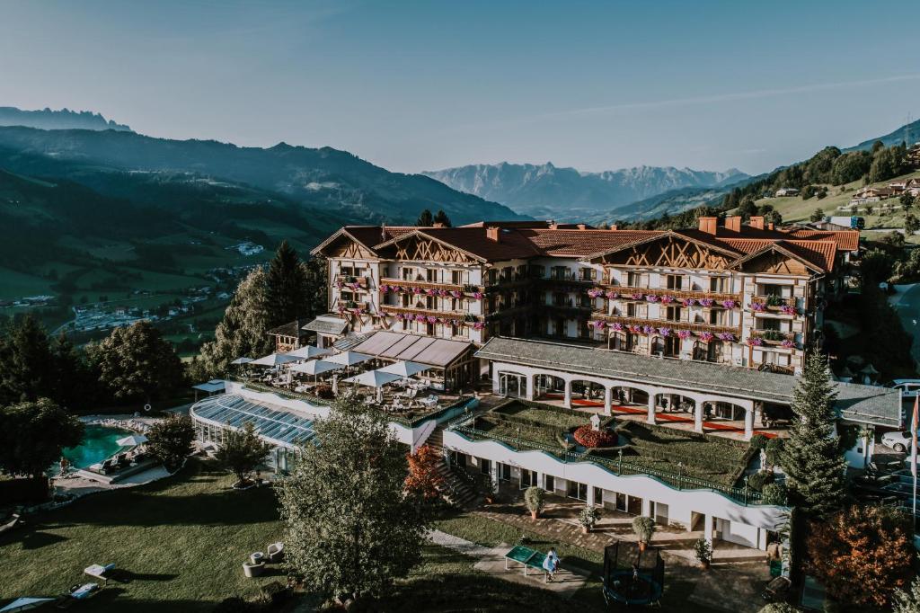 an aerial view of a hotel in the mountains at Hotel Oberforsthof in Sankt Johann im Pongau