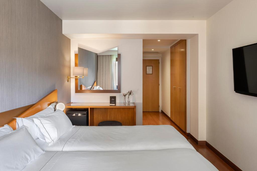 Postel nebo postele na pokoji v ubytování Hotel de l'Isard