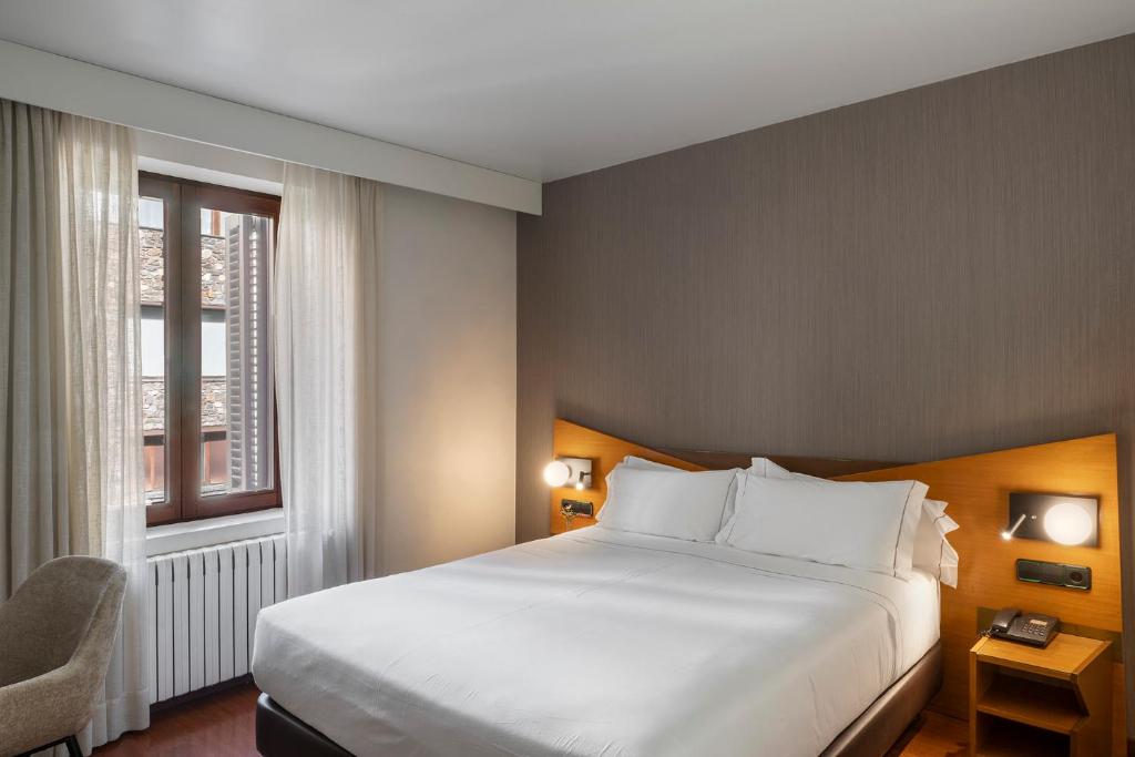 Postel nebo postele na pokoji v ubytování Hotel de l'Isard