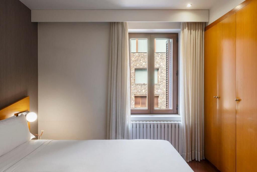 Postel nebo postele na pokoji v ubytování Hotel de l'Isard