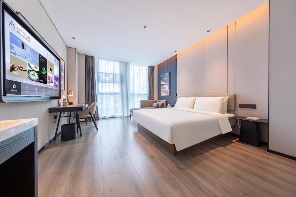 Postel nebo postele na pokoji v ubytování Atour Hotel Guangzhou Huangpu Development Zone Baoying