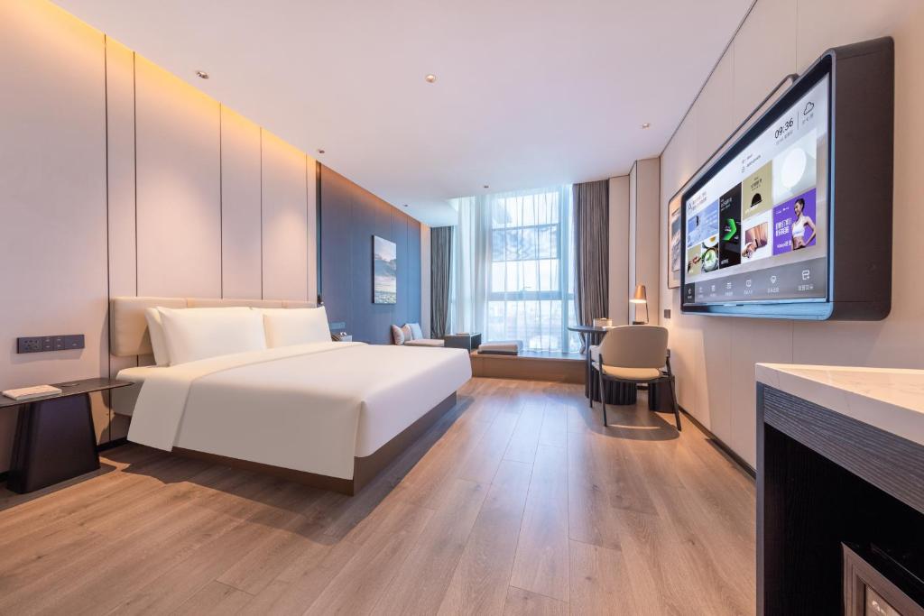 Postel nebo postele na pokoji v ubytování Atour Hotel Guangzhou Huangpu Development Zone Baoying
