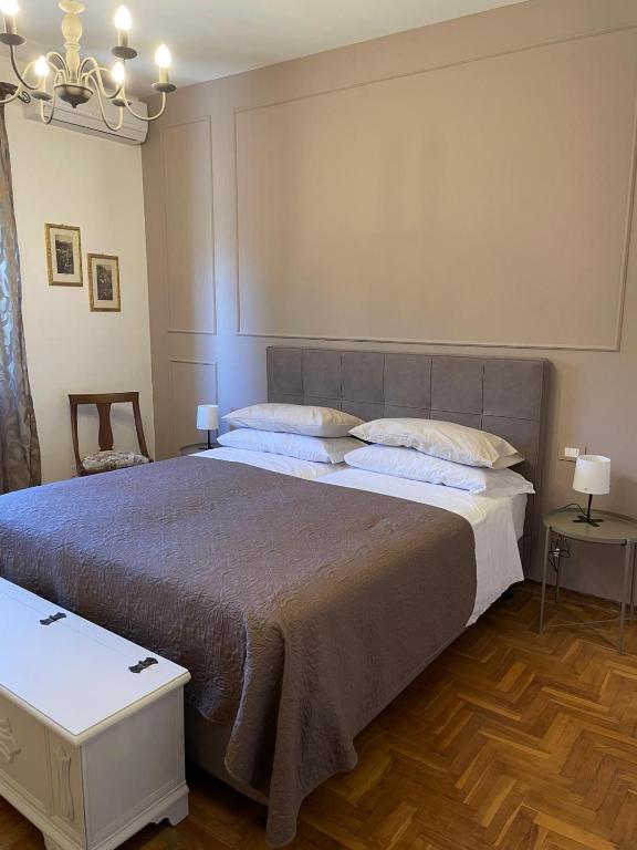Postel nebo postele na pokoji v ubytování Residenza Sandrini