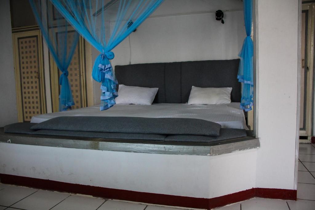 Postel nebo postele na pokoji v ubytování Mandara Bliss Retreat - මන්දාරා