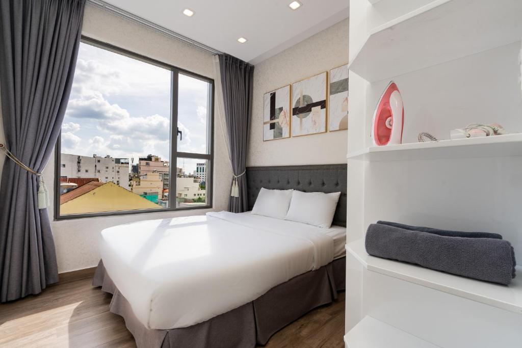 Postel nebo postele na pokoji v ubytování Double E SaiGon Apartment in Rivergate Building
