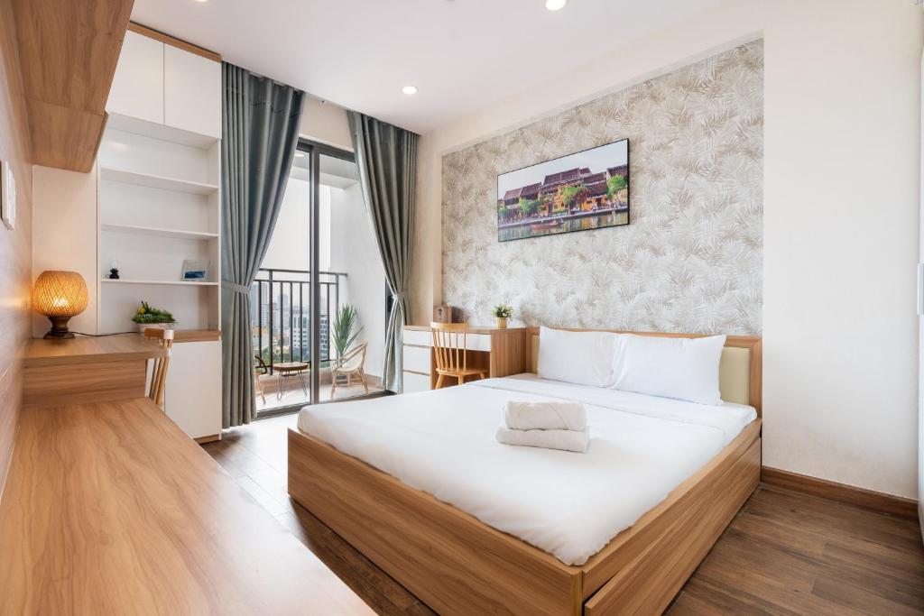 Postel nebo postele na pokoji v ubytování Double E SaiGon Apartment in Rivergate Building