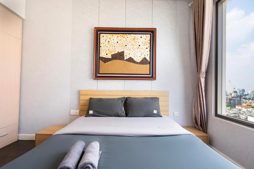 Postel nebo postele na pokoji v ubytování Double E SaiGon Apartment in Rivergate Building