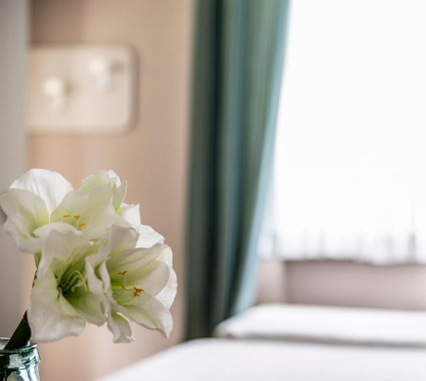 Postel nebo postele na pokoji v ubytování Hotel Maarea