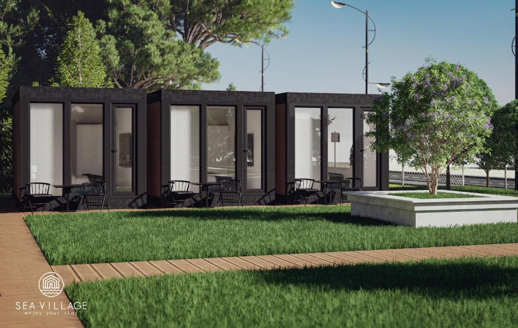 a rendering of a building with grass and trees at SeaVillage in Năvodari