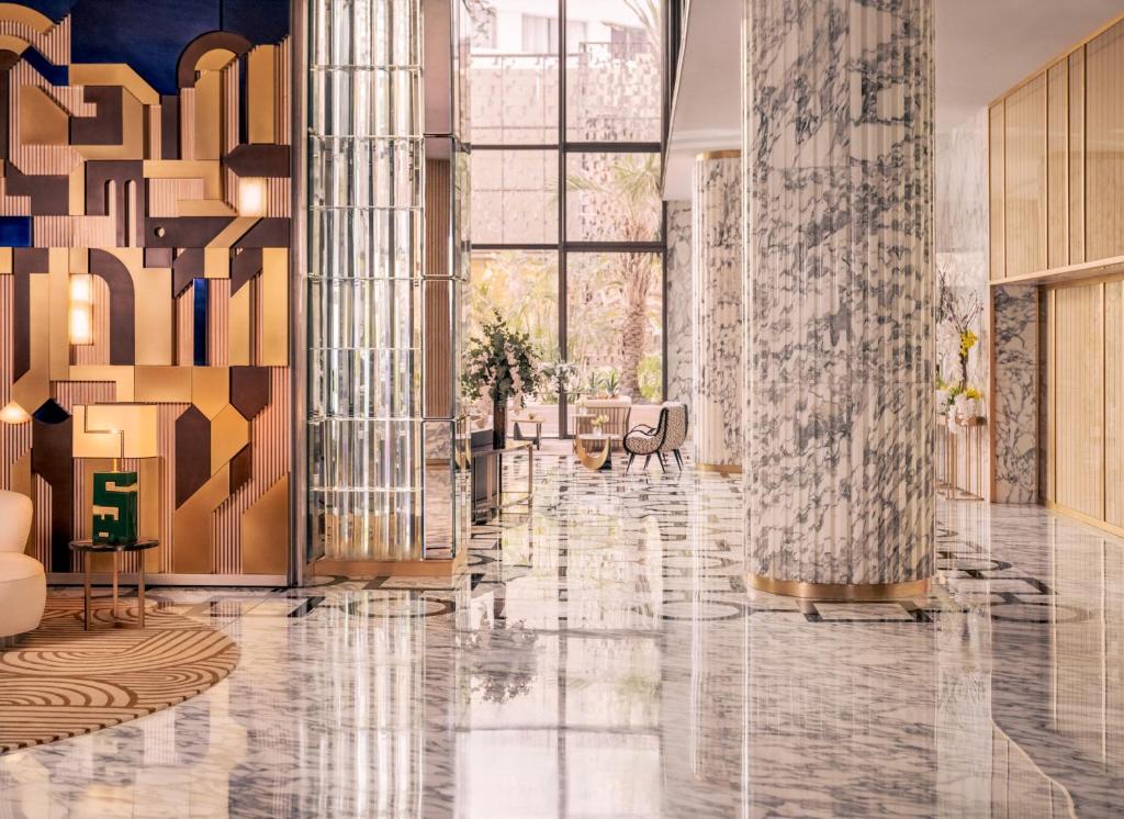 a lobby with a marble floor and large windows at Royal Mansour Casablanca in Casablanca