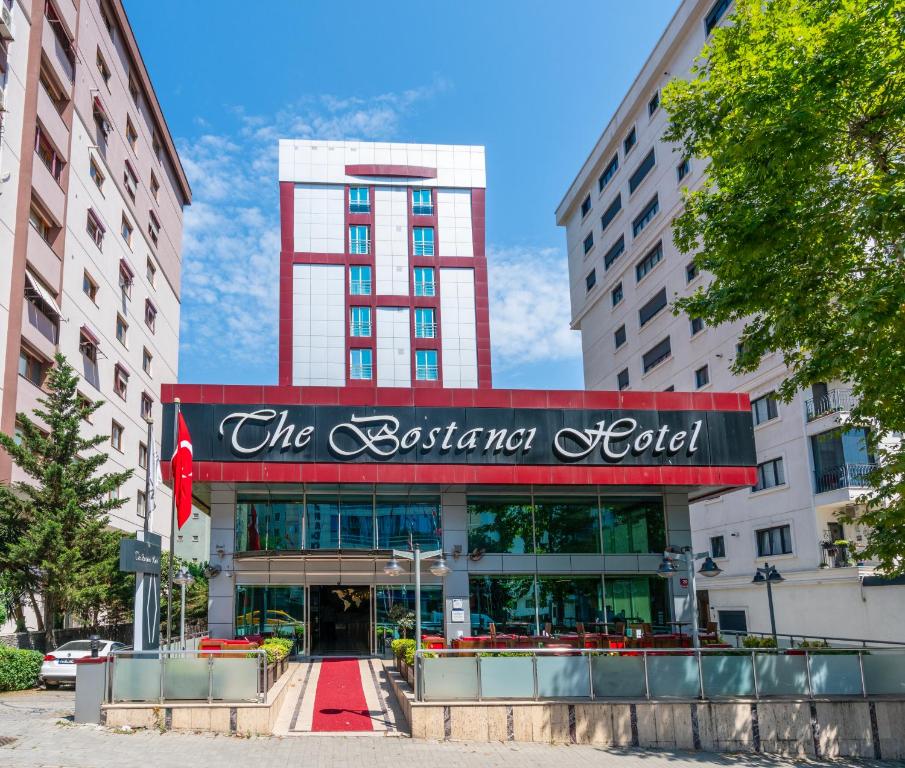 a building with a sign for the boston hotel at The Bostancı Otel in Istanbul