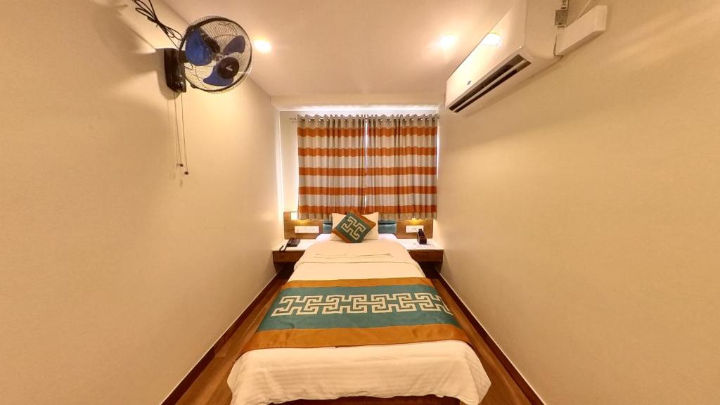 Postel nebo postele na pokoji v ubytování Hotel GRT Square