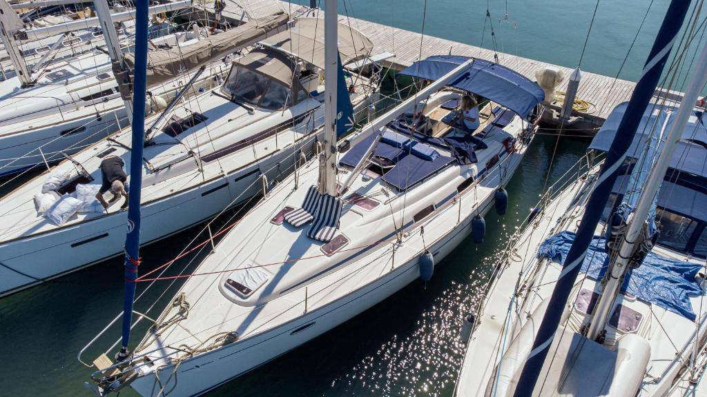 two boats docked at a dock in the water at Charming sailing boat - Le dimore di Ines in Bari