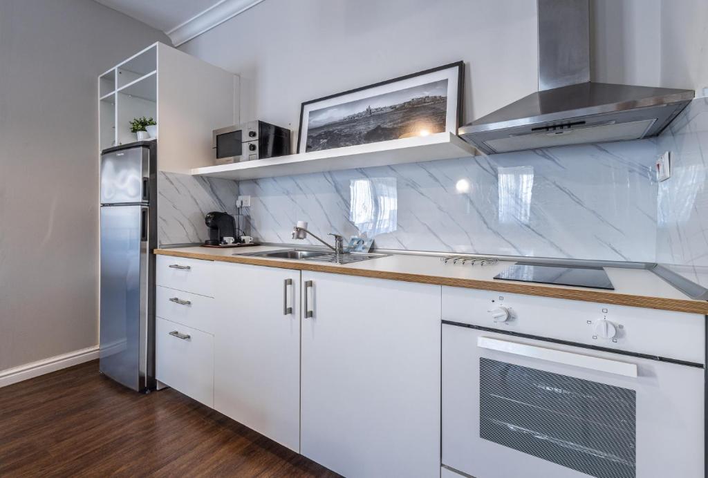 Kuchyň nebo kuchyňský kout v ubytování Park Lane Boutique Aparthotel