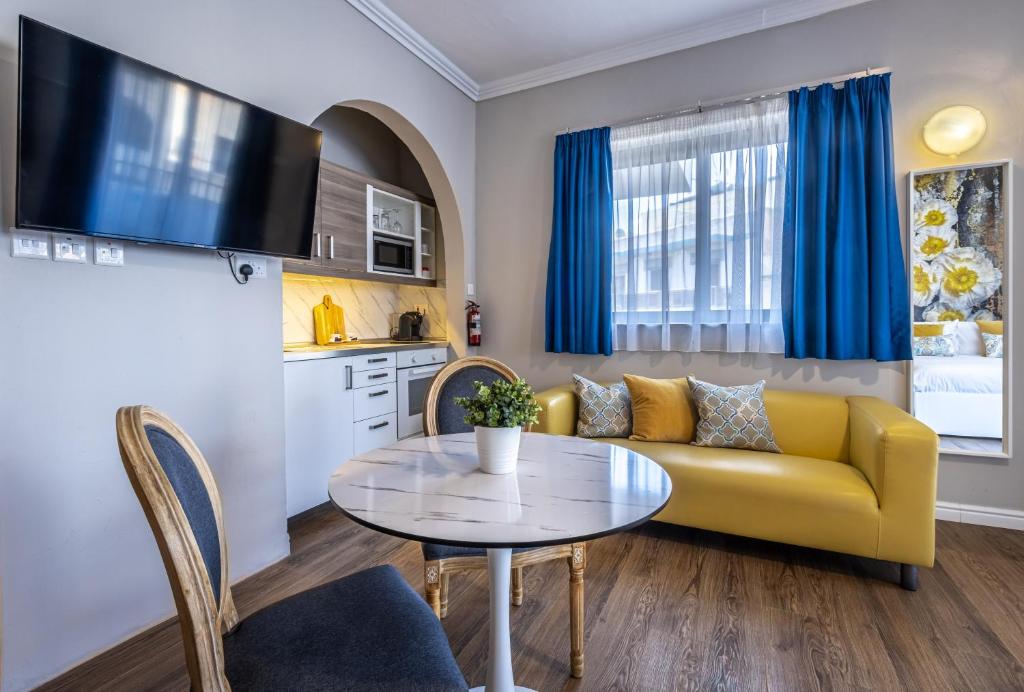 TV a/nebo společenská místnost v ubytování Park Lane Boutique Aparthotel