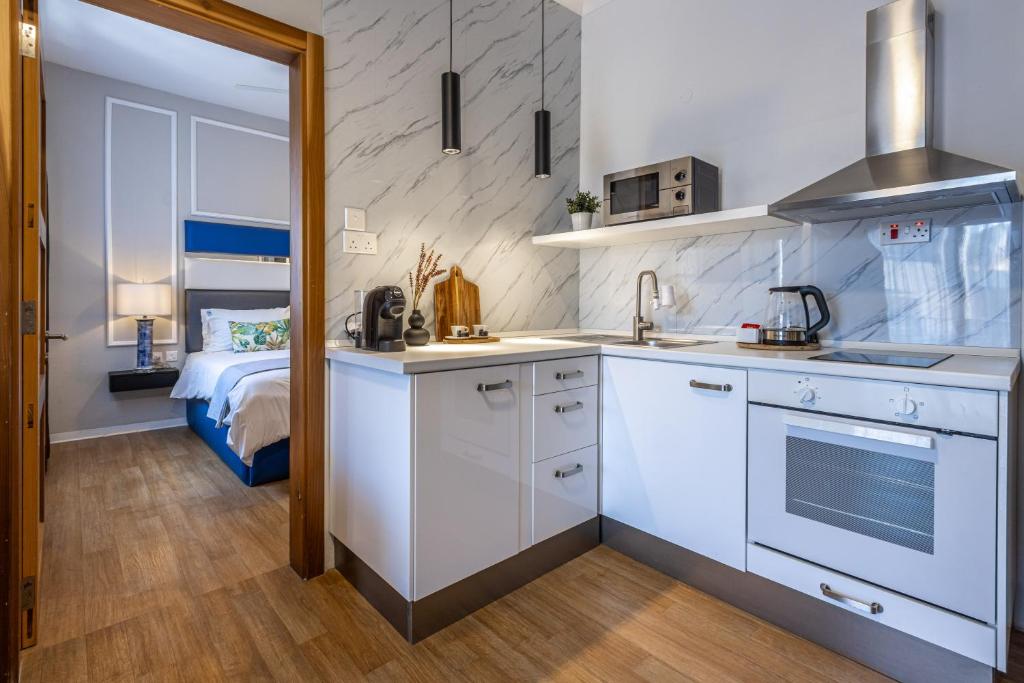 Kuchyň nebo kuchyňský kout v ubytování Park Lane Boutique Aparthotel