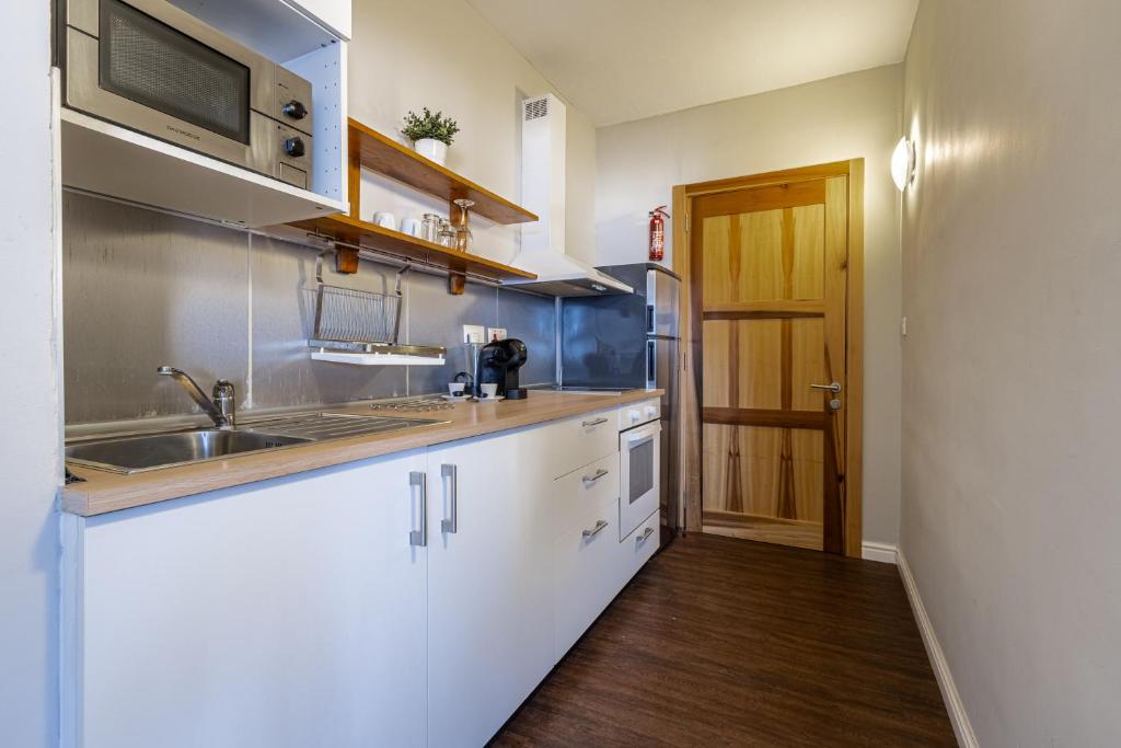 Kuchyň nebo kuchyňský kout v ubytování Park Lane Boutique Aparthotel