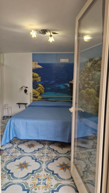 A bed or beds in a room at Al Geranio B&B