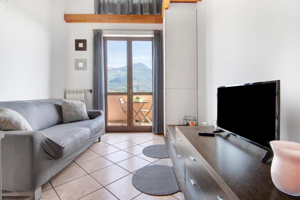 TV a/nebo společenská místnost v ubytování Casa vacanze vigna del Lago