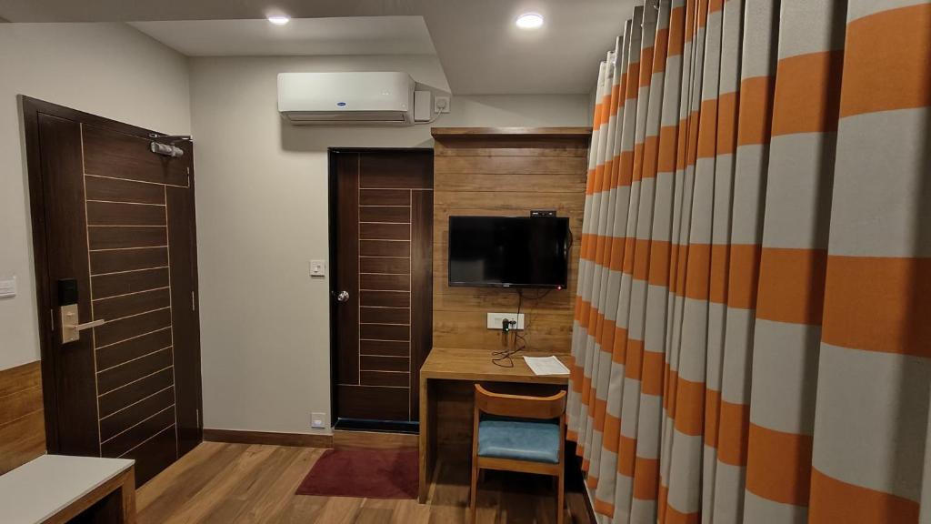 TV a/nebo společenská místnost v ubytování Hotel GRT Square