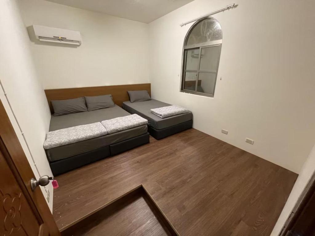 Voodi või voodid majutusasutuse Lanyu Yishanan B&B toas