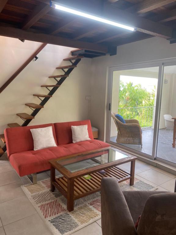 Posezení v ubytování Le Colonial Cocoon Apartement 2