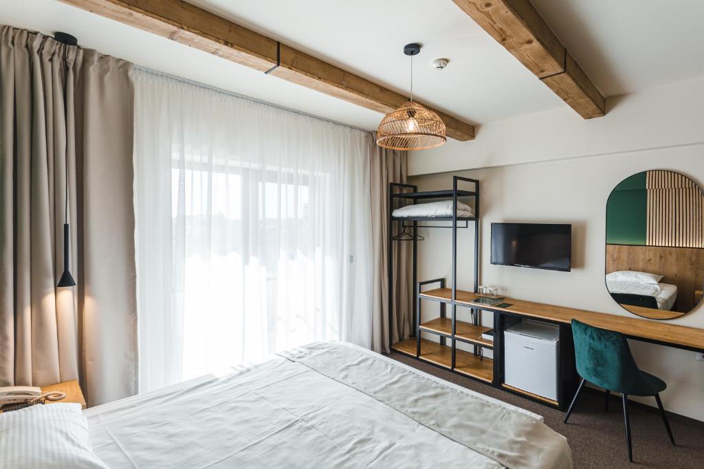 Postel nebo postele na pokoji v ubytování Stokker Hotel