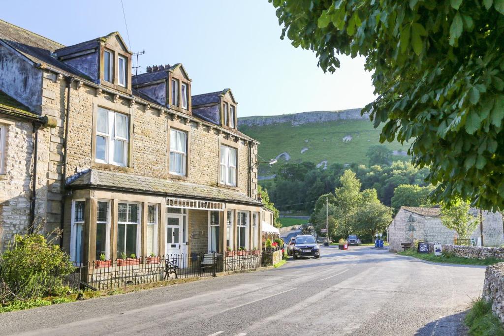 a house on the side of a street at Dale House in Kettlewell