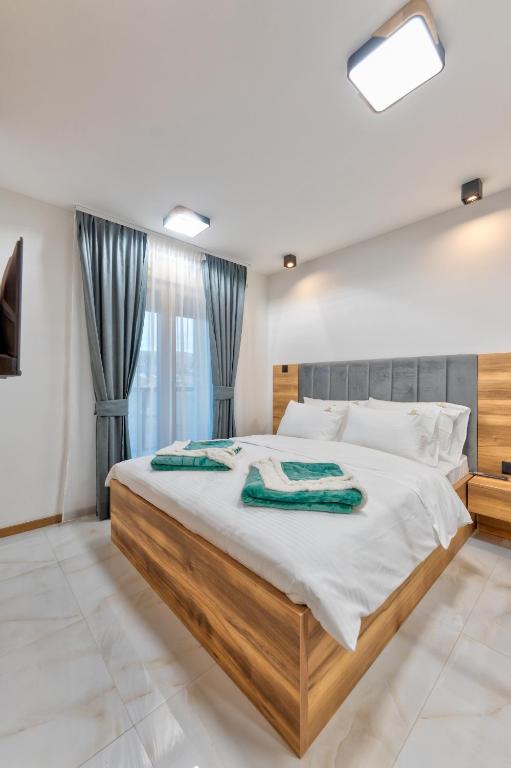 Postel nebo postele na pokoji v ubytování Golden Panorama Spa & Wellness