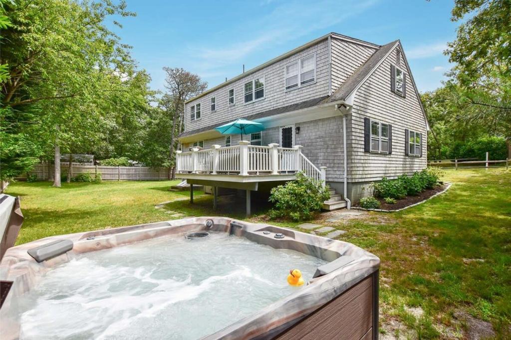 a house with a large hot tub in the yard at Perfect for Group w Kids & Dogs w Hot Tub in Chatham