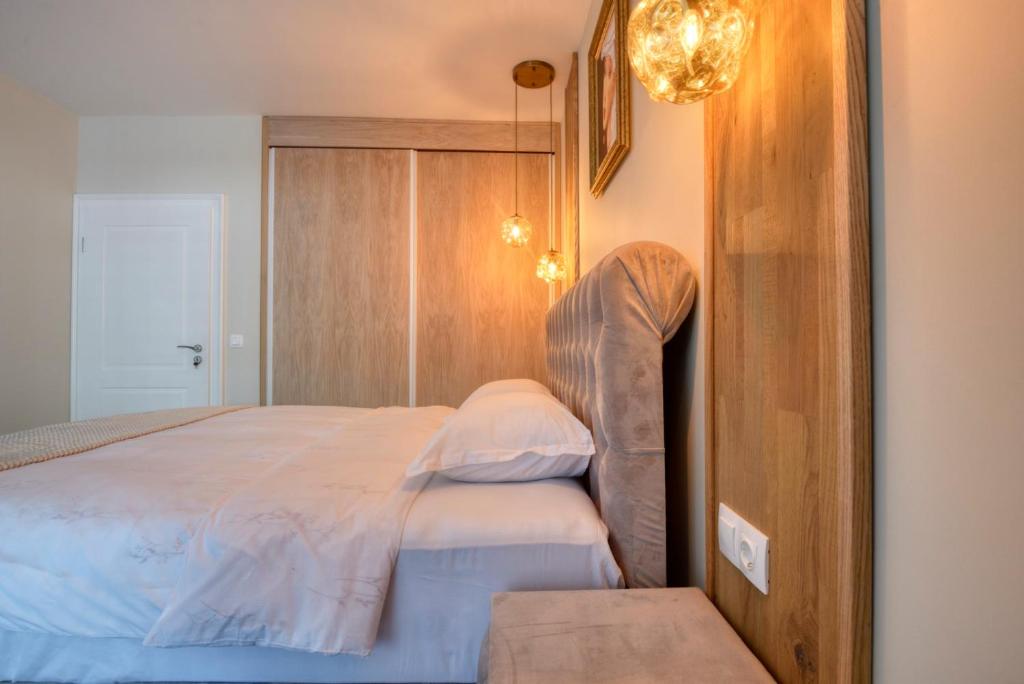 Postel nebo postele na pokoji v ubytování Apartment Grand Karavel Centre