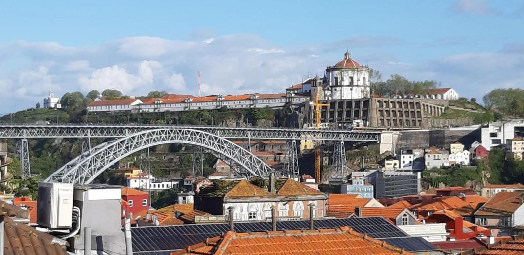 a view of a city with a bridge and buildings at 4 bedrooms apartement with city view balcony and wifi at Porto 3 km away from the beach in Porto