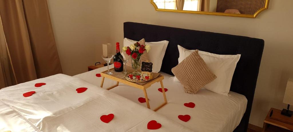 a bedroom with a bed with red hearts on it at aNNa's Cozy Home near RedBull Ring & Area 53 in Sankt Michael in Obersteiermark
