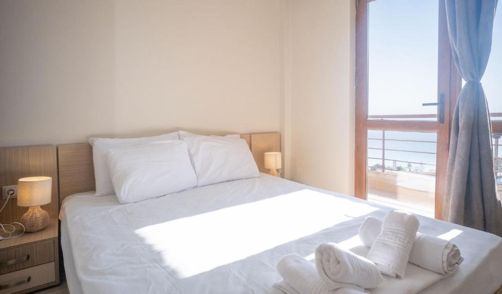Postel nebo postele na pokoji v ubytování Brezza Marina House