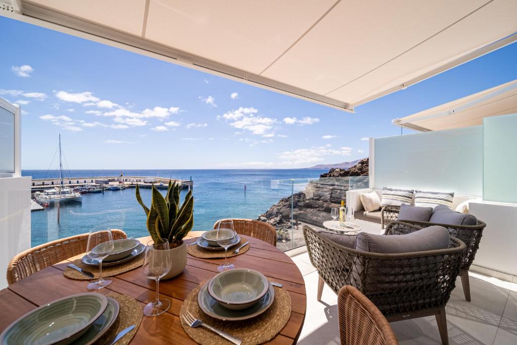 a dining room with a view of the ocean at Casa Boga in Puerto del Carmen