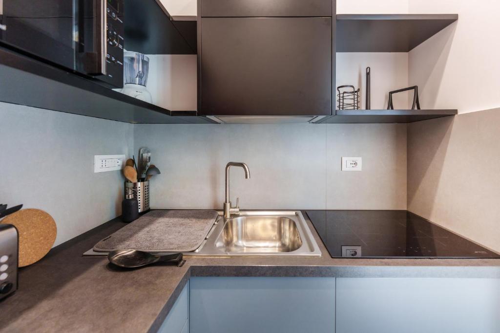 Kuchyňa alebo kuchynka v ubytovaní Casa Sasù - Design modern apartment