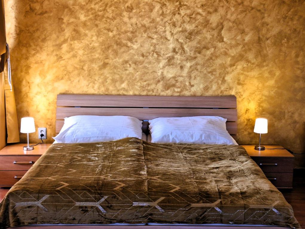 A bed or beds in a room at Penzión Villa Agnes