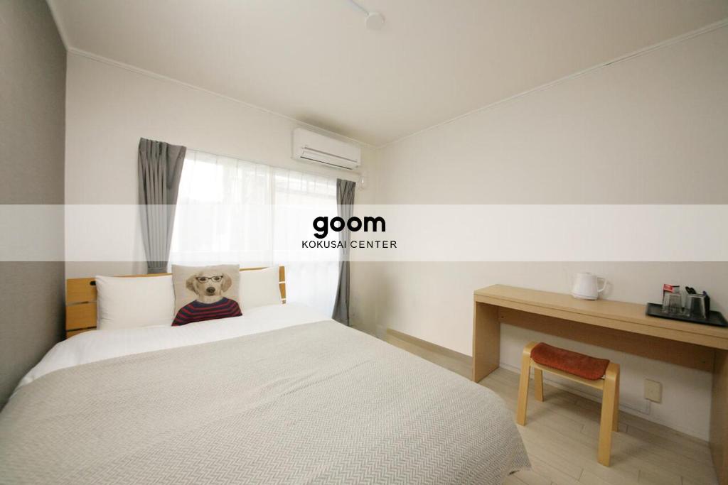 Ένα ή περισσότερα κρεβάτια σε δωμάτιο στο goom Hotel Fukuoka-Kokusai-Center