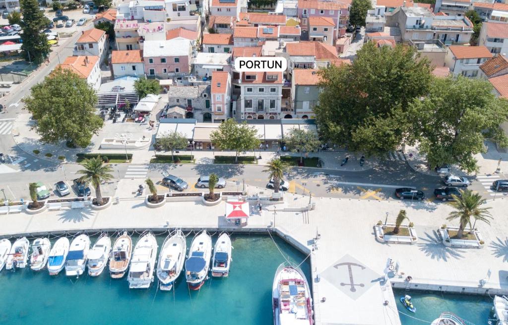 an aerial view of a marina with boats in the water at Apartments Portun Top Center in Baška Voda