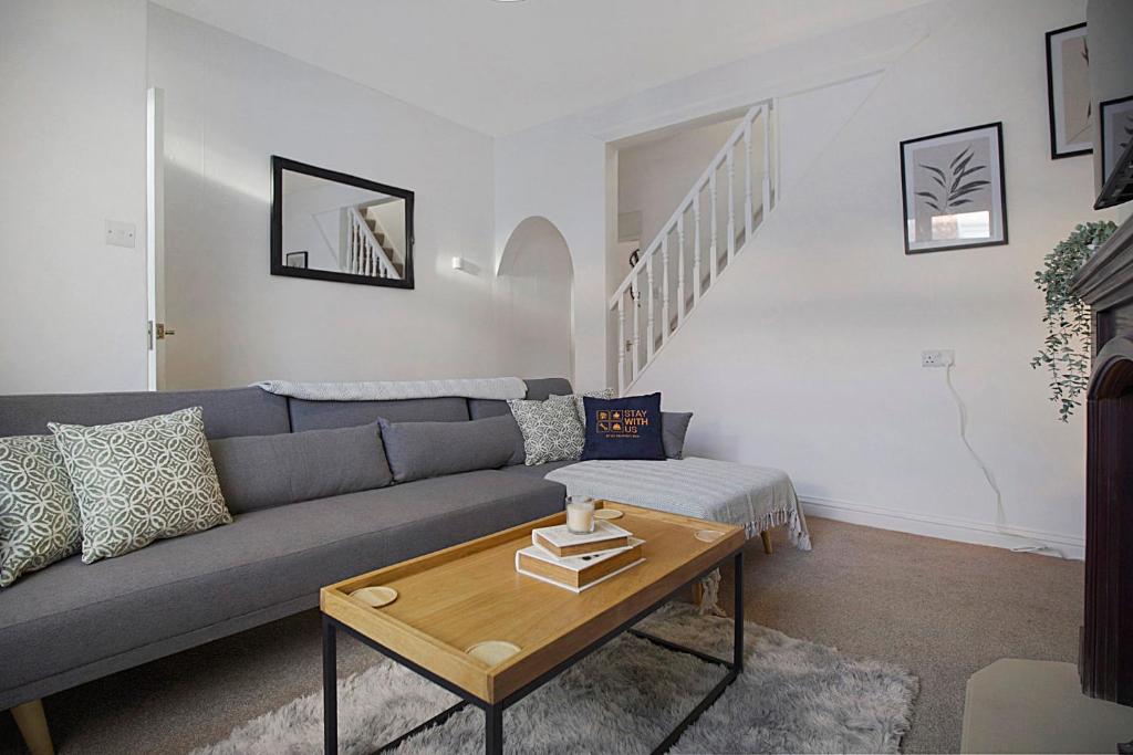 a living room with a couch and a table at Peaceful Dwelling at Falmer Road, Sleeps 4 in Darlington